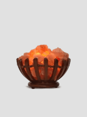 Premium Himalayan pink salt chunks in a decorative wooden bowl lamp by Suhail Salt, a leading pink salt manufacturer and exporter.