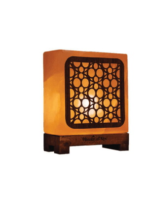"Square Himalayan pink salt lamp with geometric circle pattern design - Suhail Salt manufacturer - warm glowing salt lamp on wooden base"