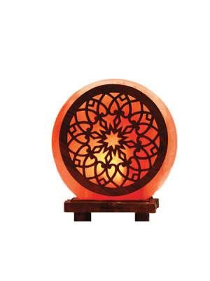 "Himalayan pink salt lamp with mandala flower pattern design - Suhail Salt manufacturer - warm glowing salt lamp on wooden base"