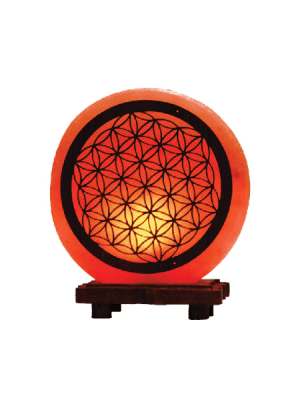"Himalayan pink salt lamp with Flower of Life geometric design - Suhail Salt manufacturer - glowing warm orange light on wooden base"