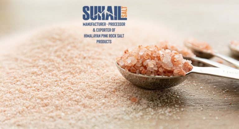 Authentic natural shape Himalayan pink salt lamp on a handcrafted wooden base by Suhail Salt, a leading manufacturer and global supplier.