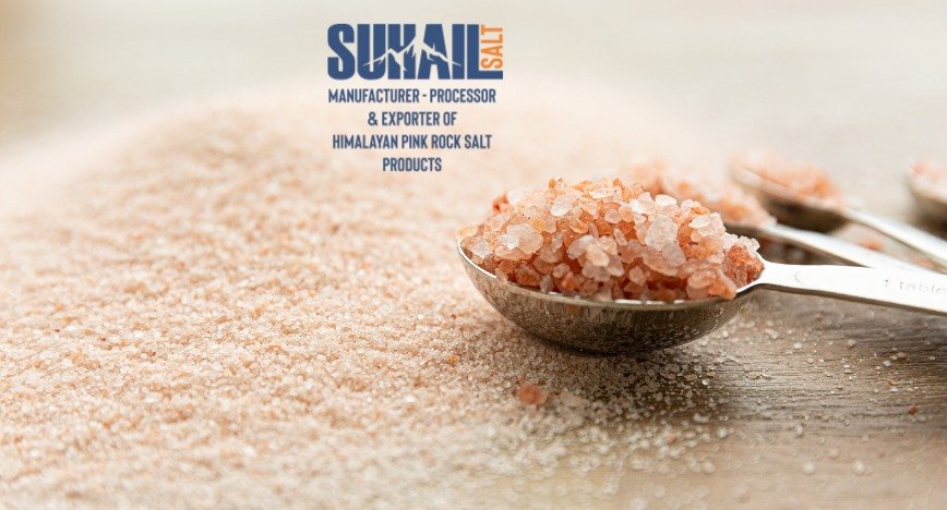 Authentic natural shape Himalayan pink salt lamp on a handcrafted wooden base by Suhail Salt, a leading manufacturer and global supplier.
